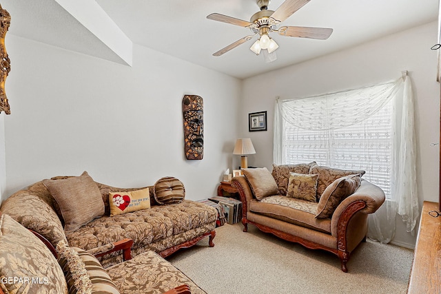 living room with ceiling fan and carpet flooring