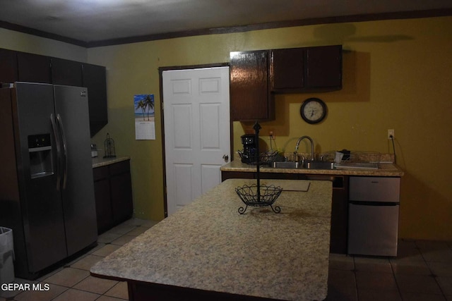 kitchen featuring sink, dark brown cabinets, fridge, a center island, and stainless steel fridge with ice dispenser