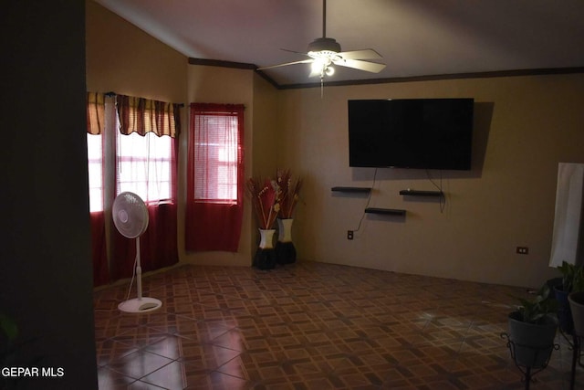 living room featuring ornamental molding, lofted ceiling, and ceiling fan