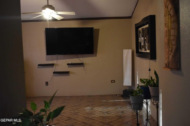 living room featuring crown molding and ceiling fan