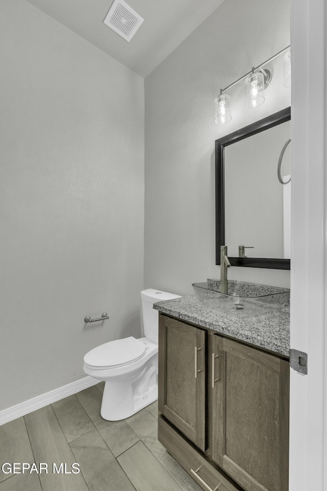 bathroom with vanity and toilet