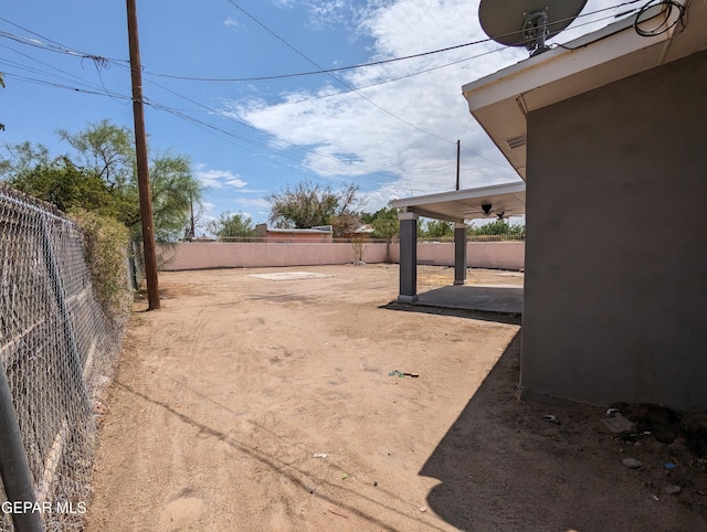 view of yard with ceiling fan