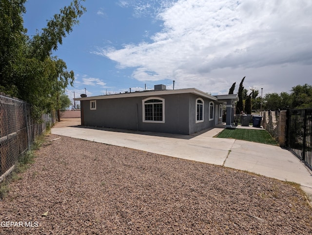 back of property with a patio