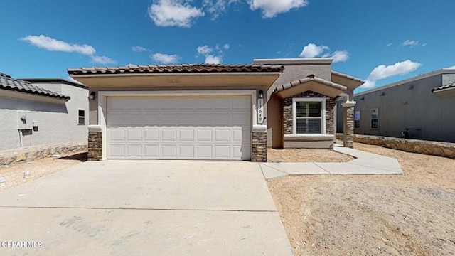 view of front of property with a garage