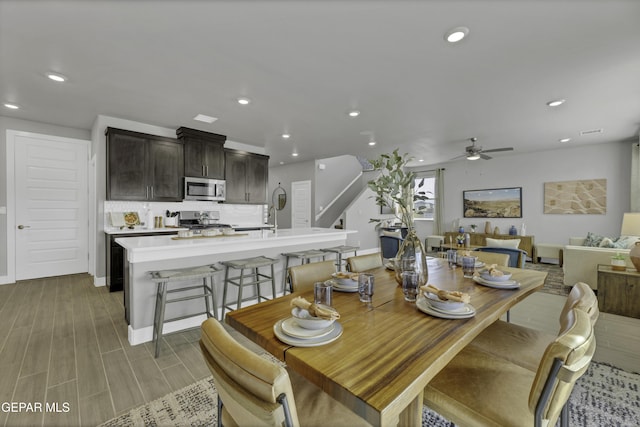 dining area featuring hardwood / wood-style floors and ceiling fan