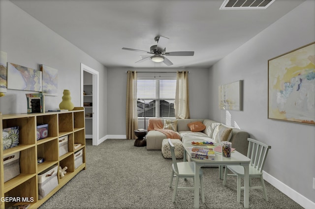 carpeted living room featuring ceiling fan