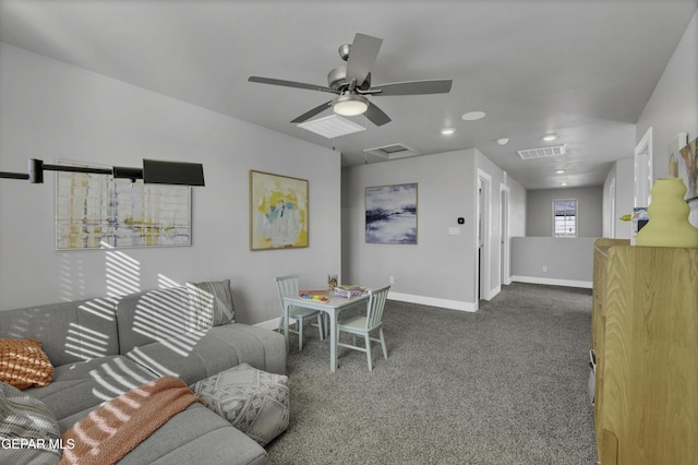 living room featuring dark colored carpet and ceiling fan