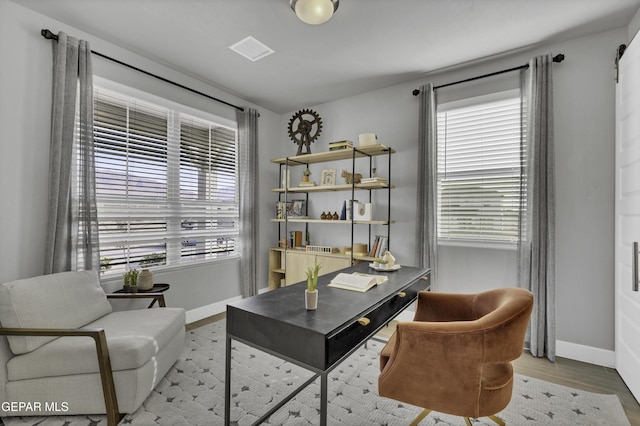 office area featuring a healthy amount of sunlight and light hardwood / wood-style floors