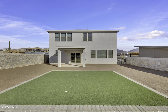 rear view of house with a patio area