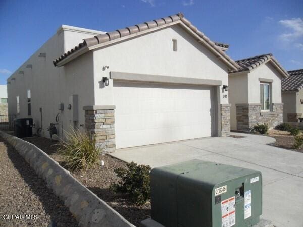 view of property exterior featuring a garage