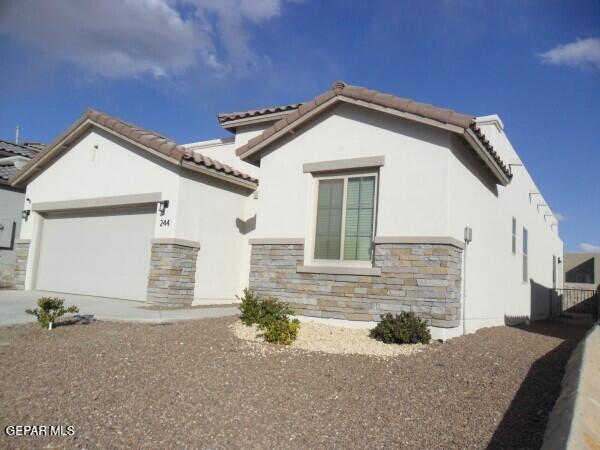 view of front of home with a garage