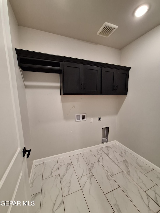 laundry area featuring hookup for a washing machine, hookup for an electric dryer, and cabinets