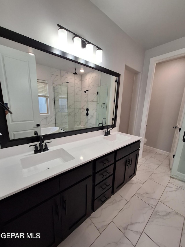 bathroom featuring vanity, toilet, and walk in shower