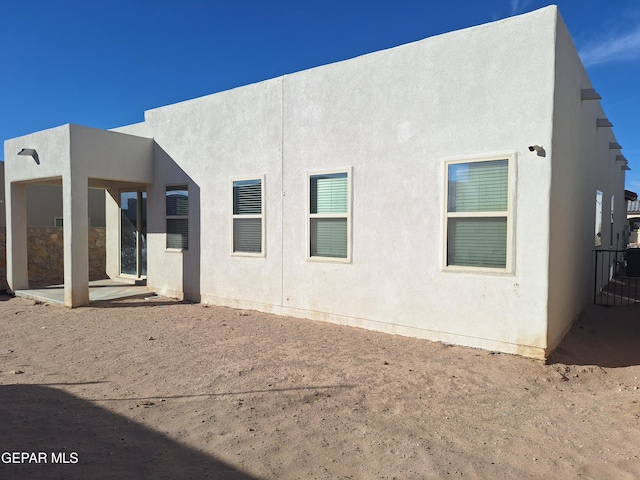 rear view of property with a patio area