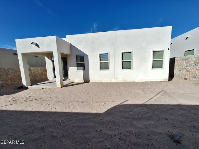 rear view of house with a patio