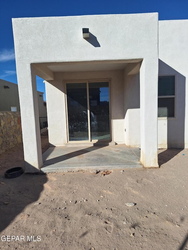 back of house featuring a patio