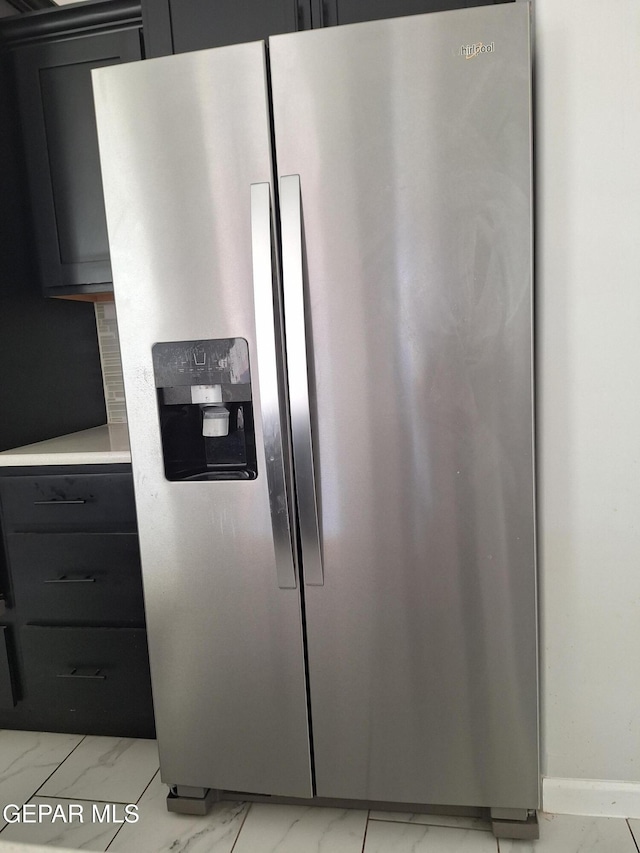 room details with stainless steel fridge