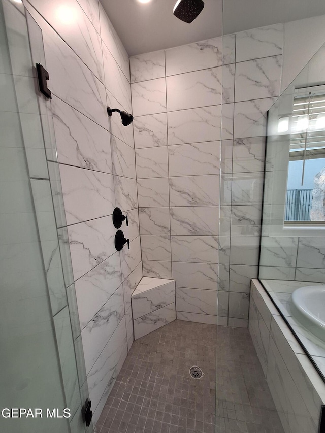 bathroom with an enclosed shower