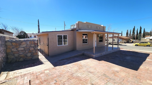 back of house with a porch