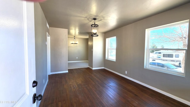 empty room with dark wood-type flooring