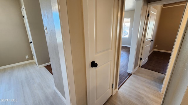 hall with light hardwood / wood-style flooring