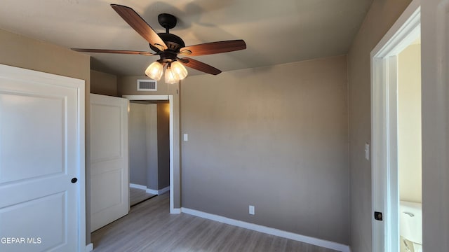 unfurnished bedroom featuring ceiling fan and light hardwood / wood-style floors