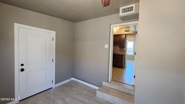 unfurnished room with light wood-type flooring