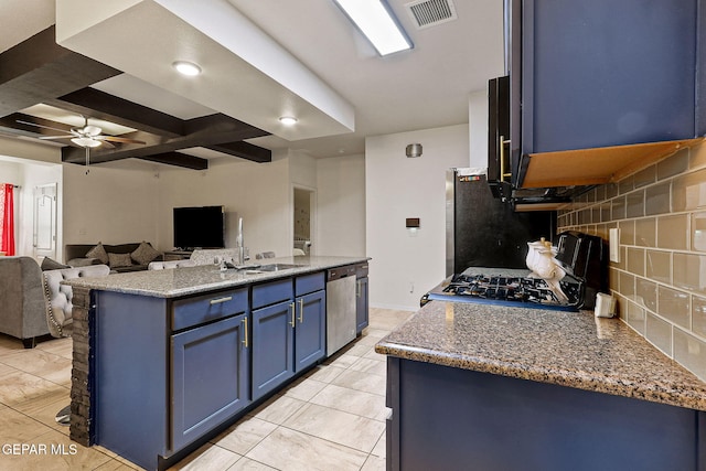 kitchen with stone countertops, decorative backsplash, ceiling fan, stainless steel appliances, and blue cabinetry