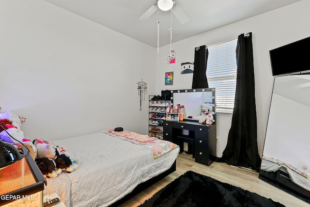 bedroom featuring ceiling fan and light wood-type flooring