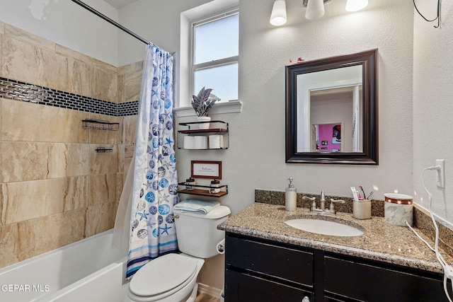 full bathroom with shower / tub combo with curtain, vanity, and toilet