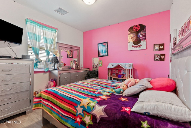 bedroom featuring hardwood / wood-style flooring