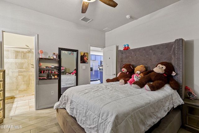 bedroom with stainless steel fridge, light hardwood / wood-style floors, and ceiling fan