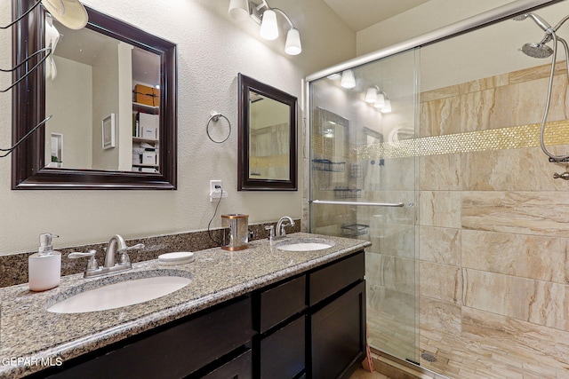 bathroom with vanity and an enclosed shower