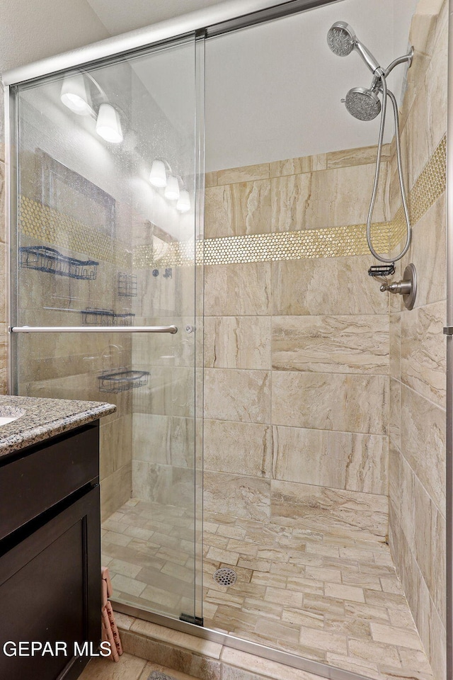 bathroom featuring vanity and walk in shower