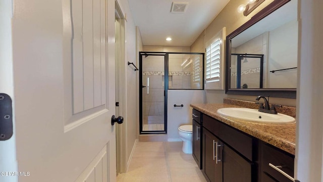 bathroom featuring vanity, toilet, and walk in shower