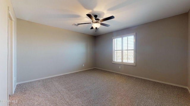 unfurnished room featuring ceiling fan and carpet floors