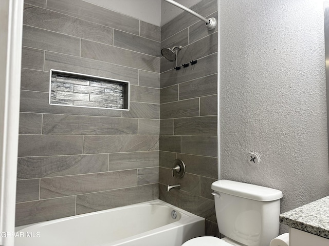 full bathroom with vanity, toilet, and tiled shower / bath