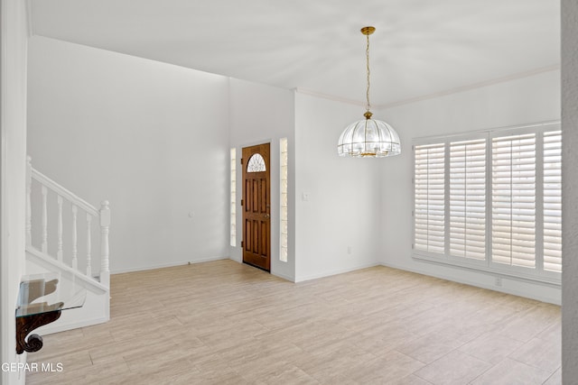 interior space featuring a notable chandelier and light hardwood / wood-style flooring