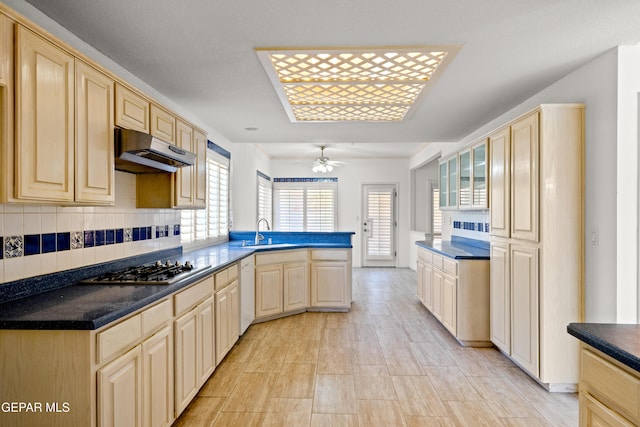 kitchen featuring dishwasher, sink, light brown cabinets, and stainless steel gas cooktop