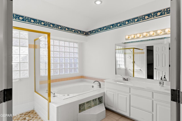 bathroom featuring tile patterned floors, vanity, separate shower and tub, and vaulted ceiling