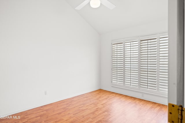 empty room featuring ceiling fan, lofted ceiling, and light hardwood / wood-style floors