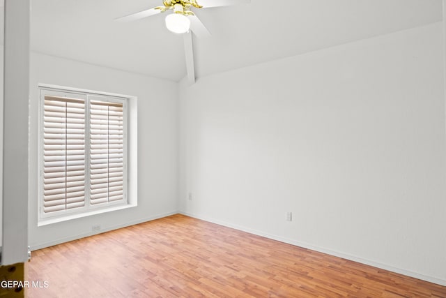 unfurnished room with ceiling fan, lofted ceiling, and light wood-type flooring