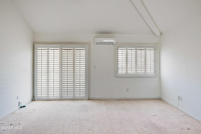 carpeted empty room with a wall unit AC and vaulted ceiling with beams