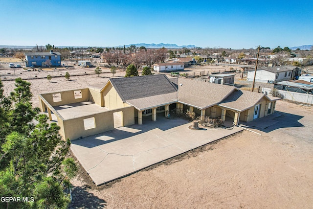 birds eye view of property with a mountain view