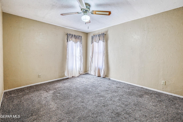 spare room with ceiling fan, carpet flooring, and a textured ceiling