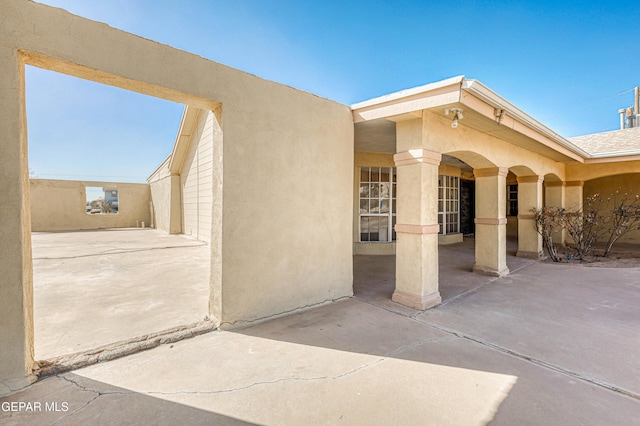 entrance to property with a patio area