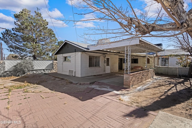 rear view of house featuring a patio