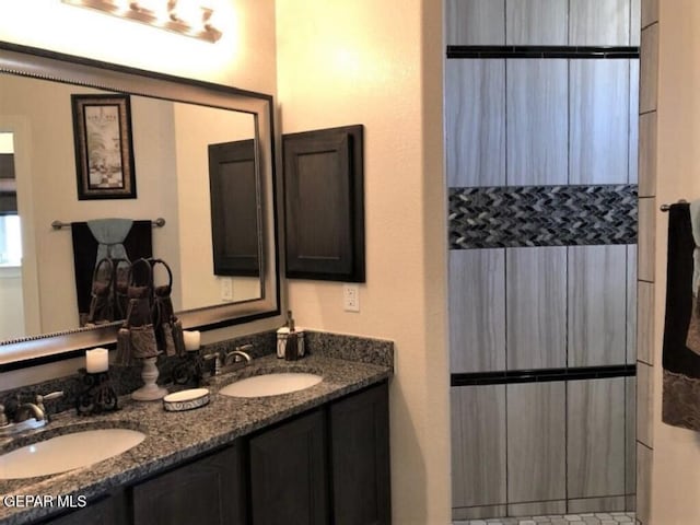 bathroom featuring double vanity and a sink