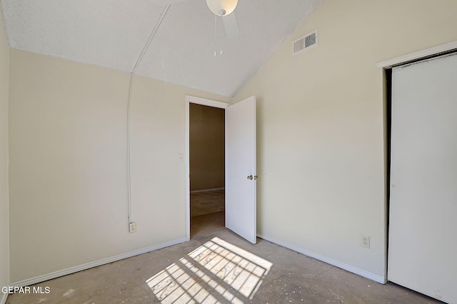 unfurnished bedroom with lofted ceiling