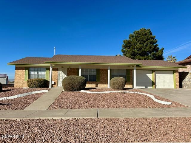 ranch-style home with a garage